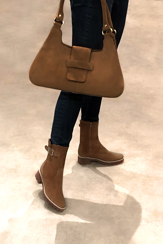 Caramel brown women's ankle boots with buckles on the sides. Round toe. Low rubber soles. Worn view - Florence KOOIJMAN